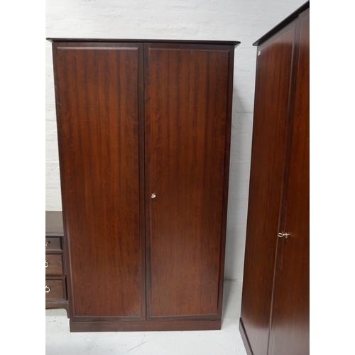 524 - STAG MAHOGANY BEDROOM SUITE
comprising a large triple door wardrobe 224cm x 174cm, a two door wardro... 