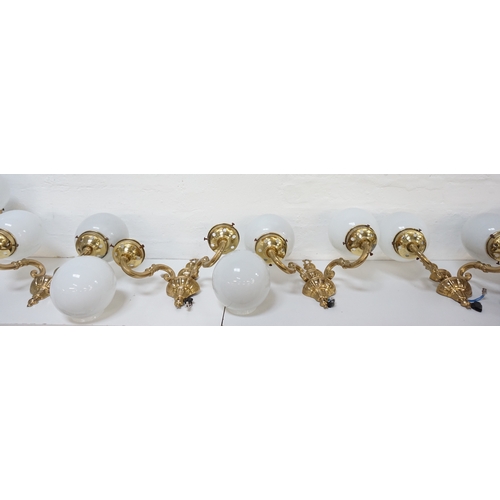 528 - SET OF FOUR GILT BRASS AND STEEL WALL LIGHTS
each with a tapering and shaped back plate with a pair ... 