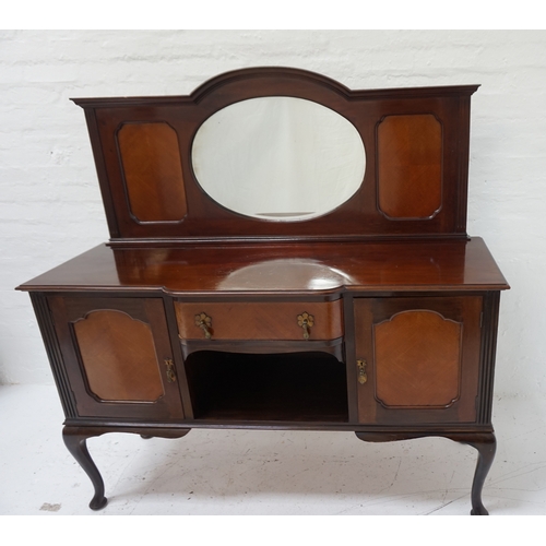 424 - MAHOGANY BREAKFRONT SIDEBOARD
the shaped raised back centred with an oval bevelled mirror, flanked b... 