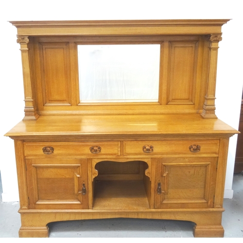 427 - ARTS AND CRAFTS OAK MIRROR BACK SIDEBOARD
with a moulded top supported by two tapering square column... 