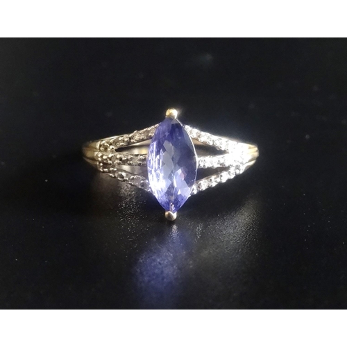 6 - TANZANITE AND DIAMOND RING
the central maquise cut tanzanite flanked by diamond set triple split sho... 
