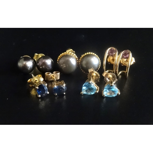 38 - FIVE PAIRS OF PEARL AND GEM SET EARRINGS
comprising two pairs of black pearl stud earrings, a pair o... 