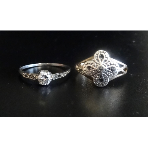 17 - TWO DIAMOND SET RINGS
one a solitaire ring of approximately 0.25cts, with further small diamonds to ... 