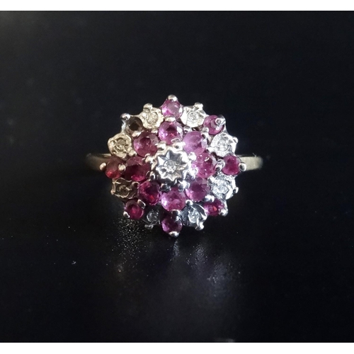 37 - DIAMOND AND RUBY CLUSTER RING
with stepped setting, on nine carat gold shank, ring size L-M - RE-OFF... 