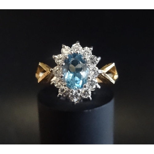 57 - BLUE TOPAZ AND DIAMOND CLUSTER RING
the central oval cut topaz in twelve diamond surround, on nine c... 
