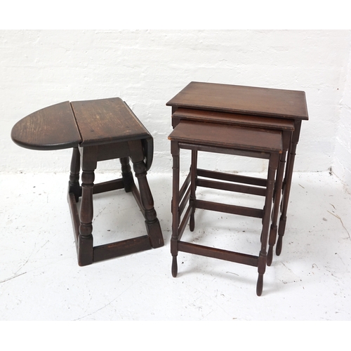 420 - NEST OF THREE MAHOGANY OCCASIONAL TABLES
with oblong tops and standing on turned supports united by ... 
