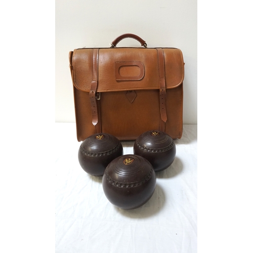 319 - SET OF FOUR R.W. HENESELL & SONS LAWN BOWLS
size 5, contained in a bowls bag - RE-OFFERED IN TIMED A... 
