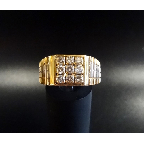 36 - GENTLEMAN'S DIAMOND SET RING
in unmarked gold with two tone stepped shoulders, the diamonds in squar... 