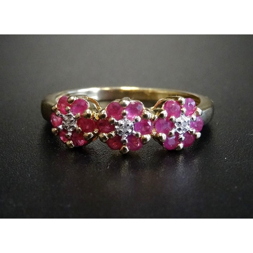 12 - RUBY AND DIAMOND TRIPLE CLUSTER RING
each of the three small diamonds in six ruby surround, on nine ... 