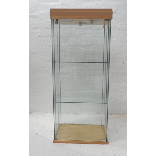 499 - ILLUMINATED GLASS DISPLAY CABINET
with a locking door, two glass shelves and wall fixings, 109cm x 4... 