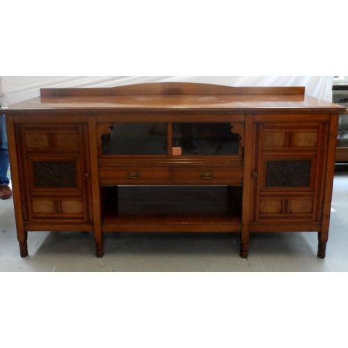 489 - EDWARDIAN OAK SIDE CABINET
with a replaced shaped and raised back above a moulded top with a pair of... 