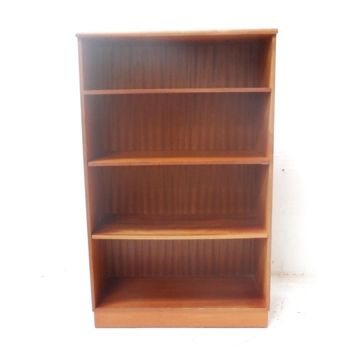 492 - TEAK OPEN BOOKCASE
with a moulded top above four shelves, standing on a plinth base, 132cm x 81cm - ... 