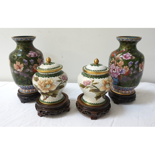 253 - PAIR OF CHINESE CLOISONNE VASES
with a dark green ground decorated with a basket of flowers, on a ci... 