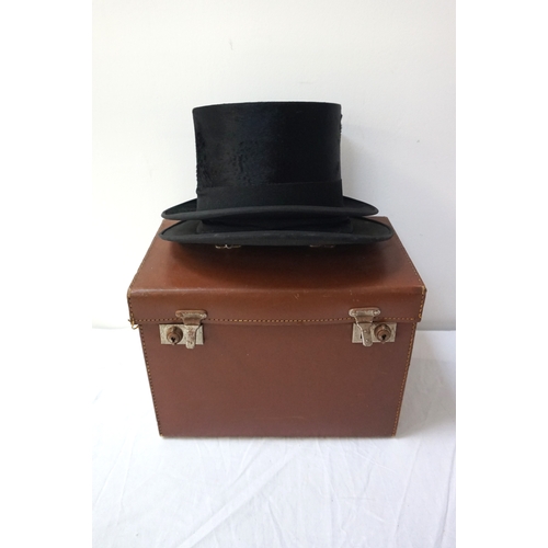 385 - GENTLEMAN'S BLACK TOP HAT
marked to the interior Paisleys Limited of Glasgow, in a brown leather car... 