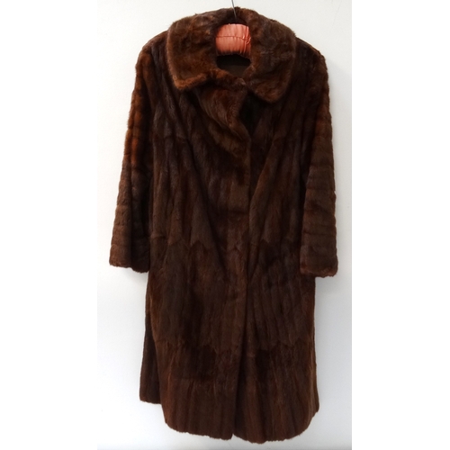 388 - LADIES RUSSIAN ERMINE COAT
full length and marked to the collar 'Karter', together with a matching h... 