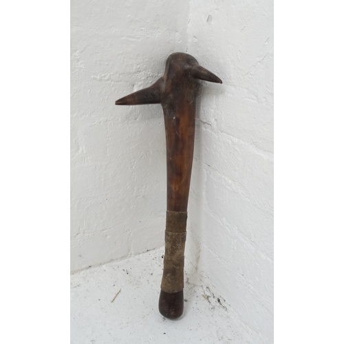 298 - HARDWOOD CLUB
possibly Polynesian, of tapering form with two pointed barbs and a leather bound grip,... 