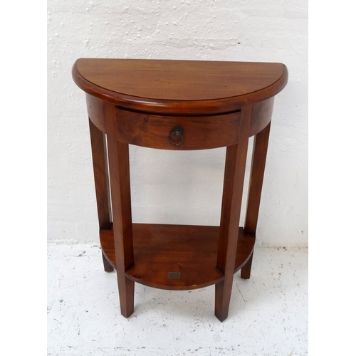 480 - ANCIENT MARINER TEAK SIDE TABLE
with a moulded D shape top above a frieze drawer, on four shaped sup... 