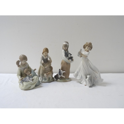 239 - FOUR LLADRO FIGURINES 
of young girls playing with cats, 24.5cm to 17.5cm high (4)