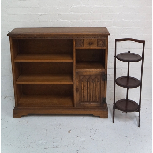 486 - CARVED OAK SIDE CABINET
with a moulded top above three open shelves and a frieze drawer with an open... 