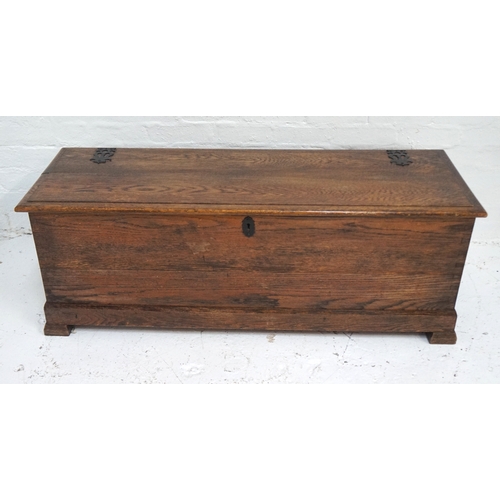 497 - OAK COFFER
with a moulded lift up lid with decorative false hinges, side carrying handles and standi... 