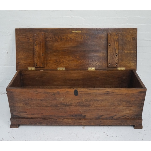 497 - OAK COFFER
with a moulded lift up lid with decorative false hinges, side carrying handles and standi... 