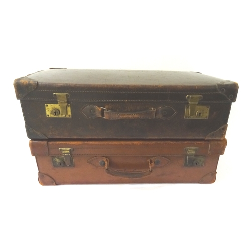 306 - TWO VINTAGE LEATHER SUITCASES
each with re-enforced corners, brass locks and carry handles (2)