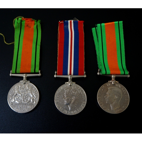 430 - TWO WORLD WAR II GEORGE VI DEFENCE MEDALS
with ribbons together with a World War II medal and ribbon... 