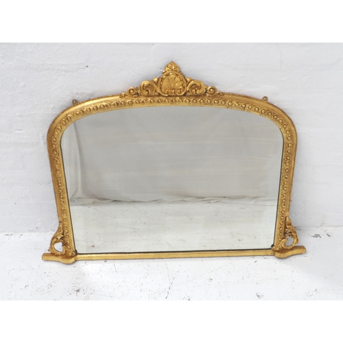 576 - 19th CENTURY GILTWOOD OVERMANTLE MIRROR
with a central carved shell and scroll pediment above the sh... 