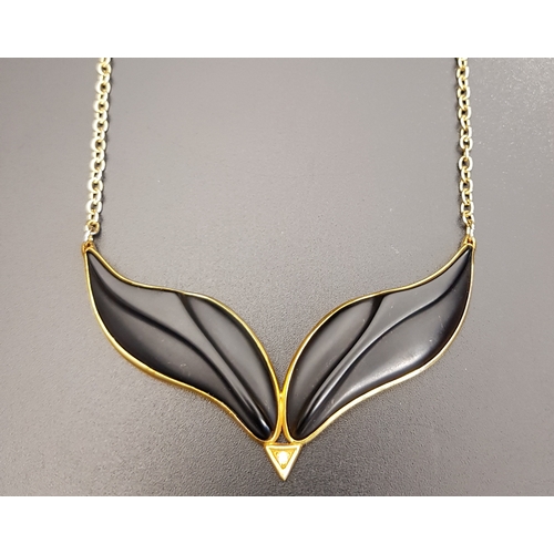 62 - UNUSUAL 1980s NINE CARAT GOLD , DIAMOND AND BLACK RESIN NECKLACE
on attached nine carat gold chain, ... 