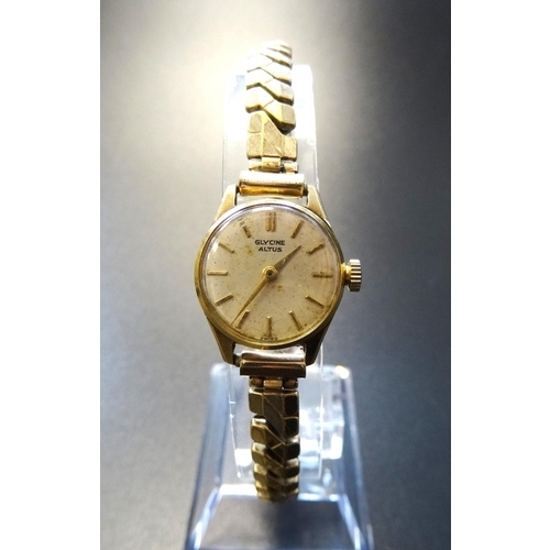 65 - LADIES FOURTEEN CARAT GOLD CASED GLYCINE ALTUS WRISTWATCH
the dial with baton five minute markers, o... 