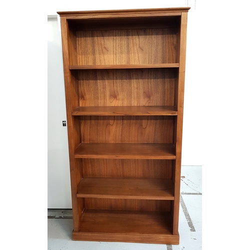 484 - LARGE TEAK BOOKCASE
with a moulded top above five shelves, standing on a plinth base, 197.5cm x 99cm