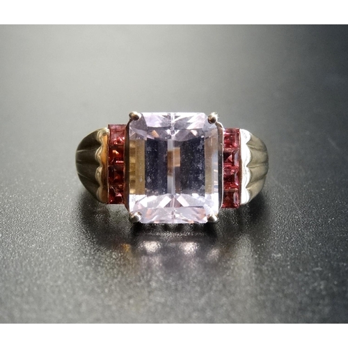 6 - PALE AMETHYST AND PINK GEM SET DRESS RING
the central emerald cut amethyst flanked by a vertical row... 