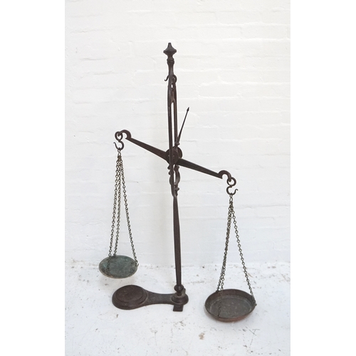 61 - SET OF VICTORIAN CAST IRON SHOP SCALES
the central balance arm with two chain link weighing bowls, r... 