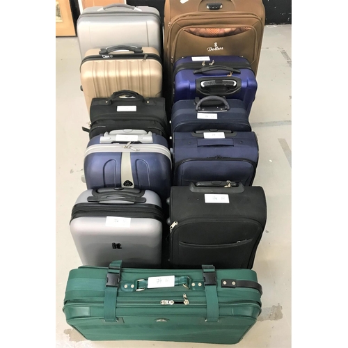 74 - SELECTION OF ELEVEN SUITCASES
Various sizes.  Empty.  Including: Elevation, Dollars, Shaik, Constell... 