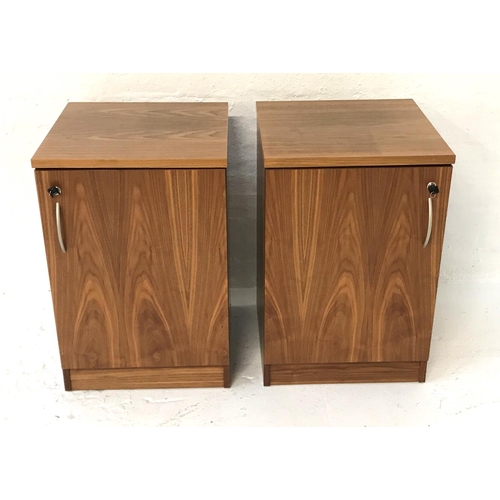 474 - PAIR OF FREM WALNUT SIDE CABINETS
with plain square tops above a lockable door with a shelved interi... 