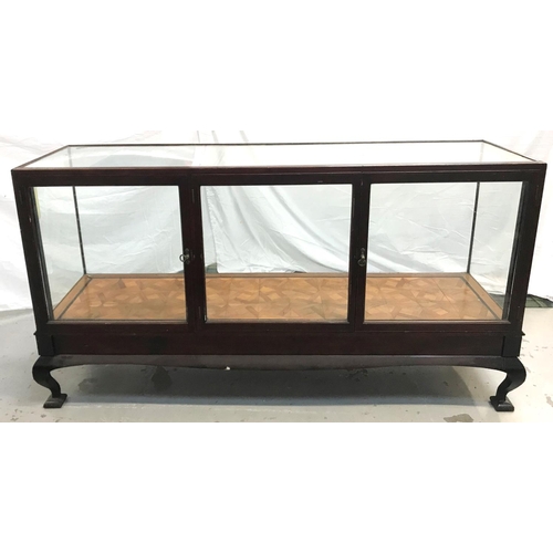 500 - MAHOGANY AND GLASS SHOP DISPLAY COUNTER
of rectangular form with three doors to the rear, and with a... 