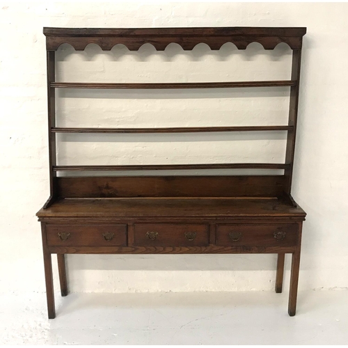 513 - GEORGIAN OAK DRESSER
with an open back with three shelves, the base with a moulded top above three d... 