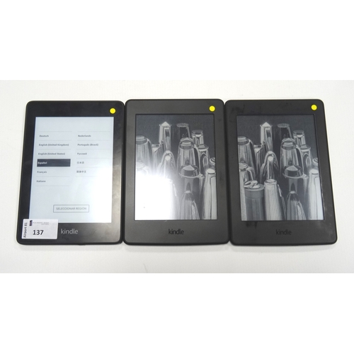 137 - THREE KINDLE PAPERWHITE DEVICES
comprising: one KINDLE PAPERWHITE 4 (2018) WIFI (8GB), serial number... 