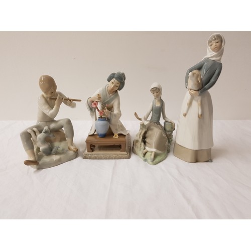 231 - THREE LLADRO FIGURINES
comprising a young girl holding a lamb, 27.5cm high, a seated young girl with... 