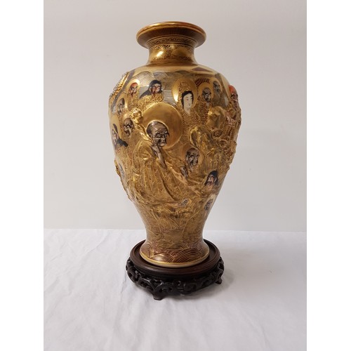 235 - JAPANESE SATSUMA VASE
of lobed form painted and gilded with multiple faces, with character mark to b... 