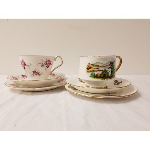 239 - SIX WINDSOR PORCELAIN TRIO TEA SETS
comprising a tea cup and saucer and tea plate, transfer decorate... 