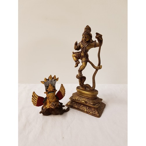 303 - BRASS DEITY KALINGA KRISHNA
holding the serpent by its tail, 16cm high; together with a brass deity ... 