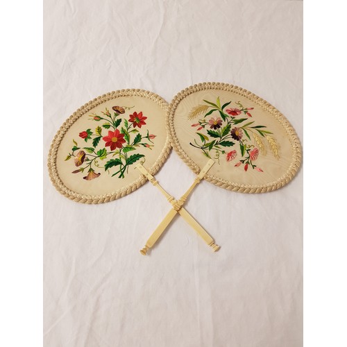 305 - TWO 19TH CENTURY CHINESE FANS
each with an oval water silk leaf embroidered with flowers above a tur... 