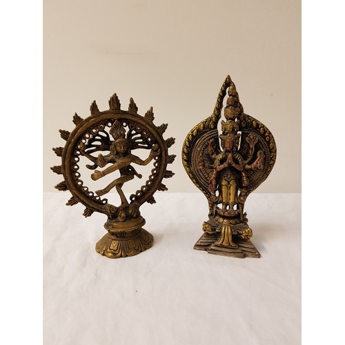 308 - INDIAN BRASS DEITY SHIVA
dancing and in traditional pose, 13.5cm high; together with the brass deity... 