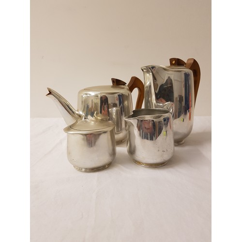 316 - PICQUOT WARE FOUR PIECE TEA SET
comprising a tea pot, hot water jug, lidded sugar bowl and a milk ju... 