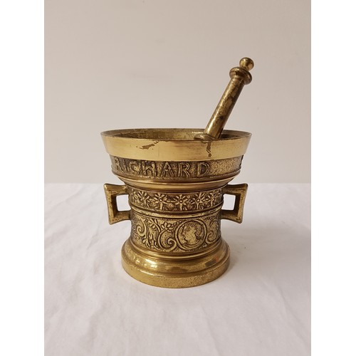 320 - BRASS MORTAR AND PESTLE
of tapering form with embossed decoration