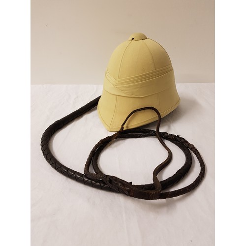 325 - MODERN PITH HELMET
with adjustable headband and chinstrap; together with a leather plaited bull whip... 