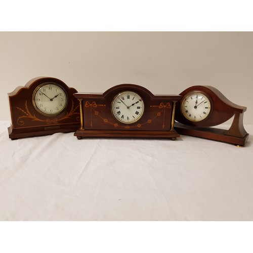 334 - EDWARDIAN MAHOGANY MANTLE CLOCK
in a shaped case, the circular enamelled dial with Roman numerals, s... 