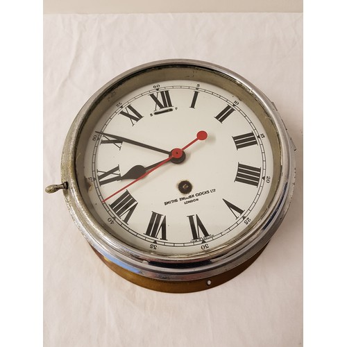 335 - SMITHS PORTHOLE STYLE CLOCK
with circular enamel dial, Roman numerals and 30 hour movement, with win... 