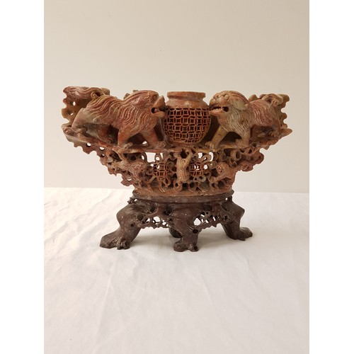 342 - CARVED CHINESE SOAPSTONE TABLE CENTREPIECE
depicting a central pierced basket flanked by lions, with... 